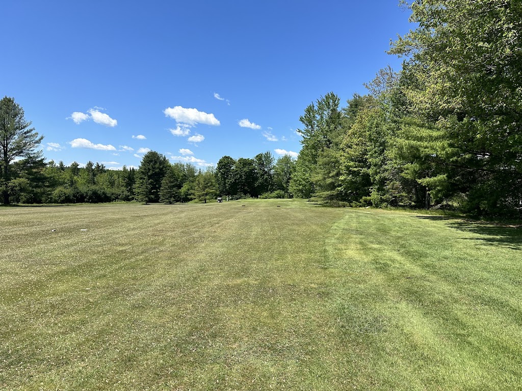 Panoramic view of a lush green golf course at Lakewood Golf Course. Smooth