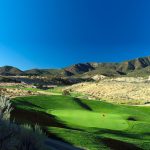 Panoramic view of a lush green golf course at Lakota Links. Smooth