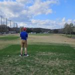 green grass with the flag in the hole.