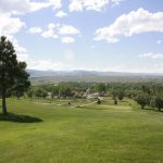 Panoramic view of a lush green golf course at Lander Golf Course & Duncle's Bar & Grill. Smooth