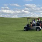 green grass with the flag in the hole.