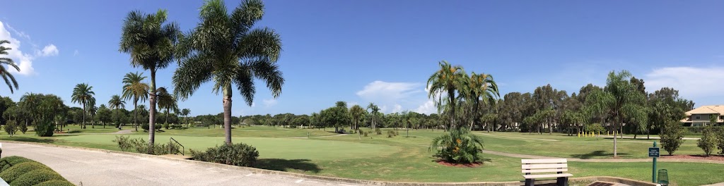 Panoramic view of a lush green golf course at Largo Golf Course. Smooth