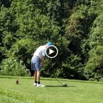 green grass with the flag in the hole.