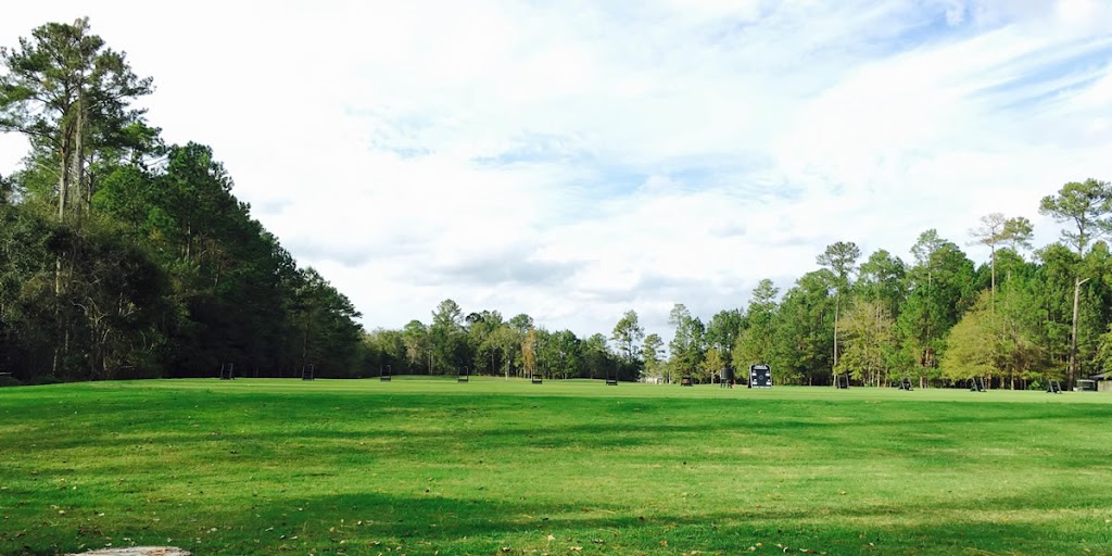 Panoramic view of a lush green golf course at Laurel Island Links. Smooth