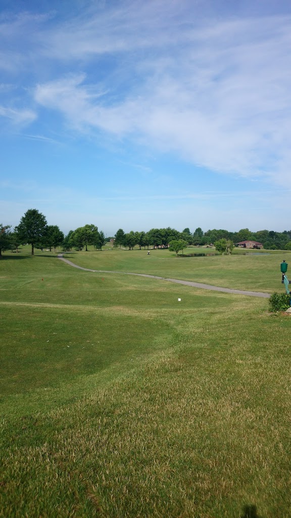 Panoramic view of a lush green golf course at Laurel Oaks Golf Club. Smooth