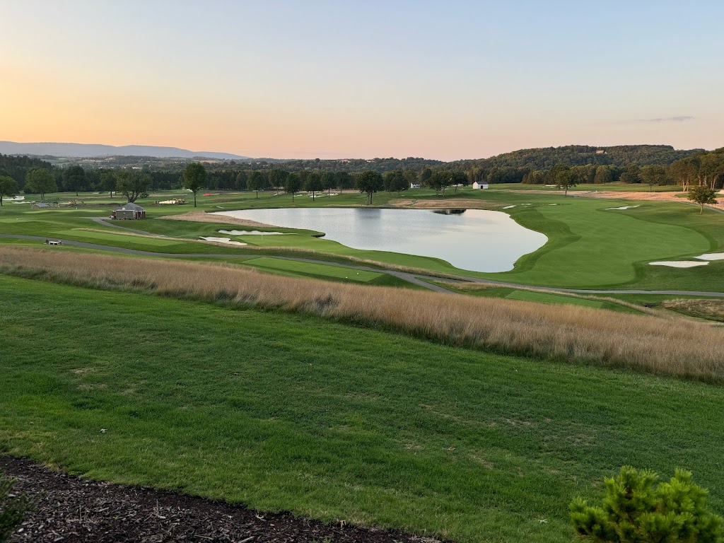 Panoramic view of a lush green golf course at Laurel Valley Golf Club. Smooth