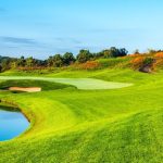 Panoramic view of a lush green golf course at LedgeRock Golf Club. Smooth