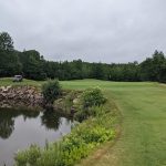 Panoramic view of a lush green golf course at Ledges Golf Club. Smooth