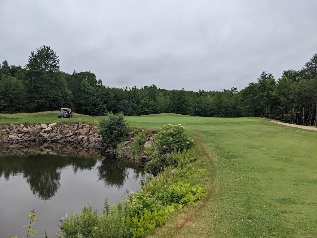 Panoramic view of a lush green golf course at Ledges Golf Club. Smooth