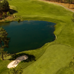 Panoramic view of a lush green golf course at Legacy. Smooth