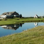 Panoramic view of a lush green golf course at Legacy By Arthur Hills Golf Club. Smooth