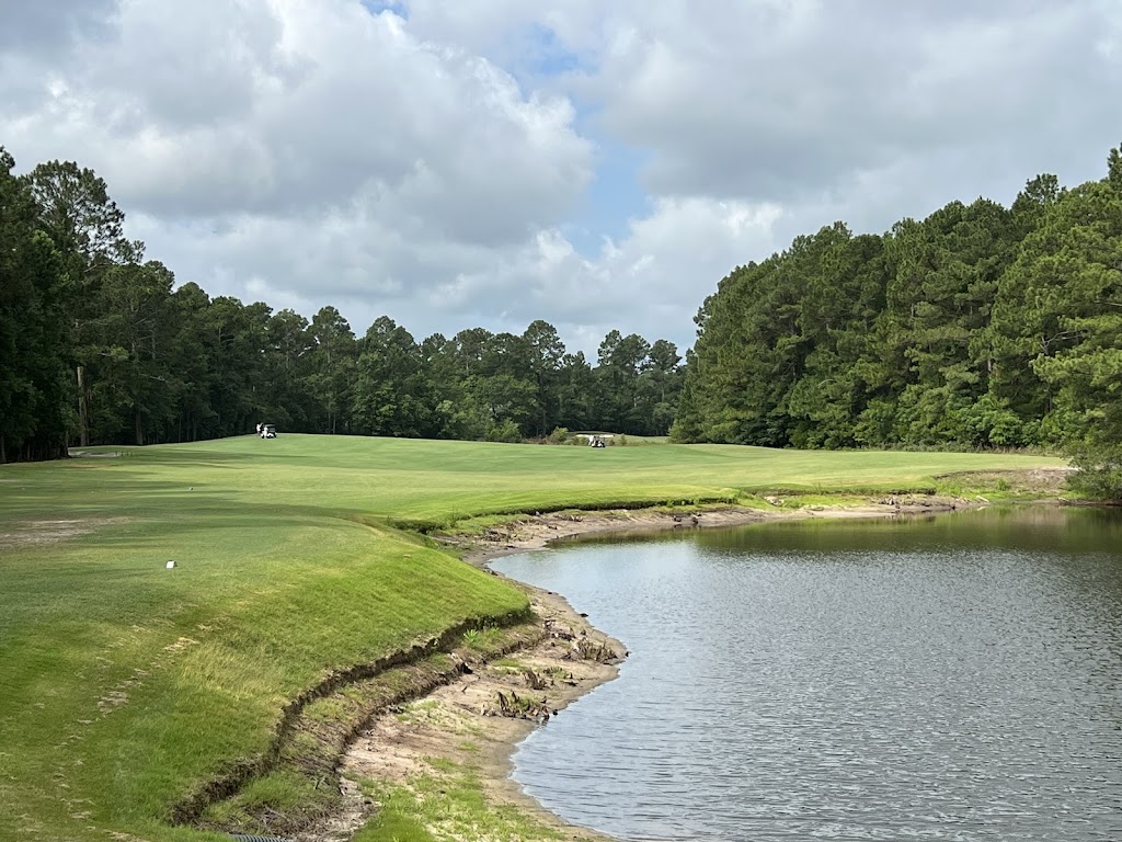 Panoramic view of a lush green golf course at Legends Golf & Resort. Smooth