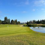 Panoramic view of a lush green golf course at Legion Memorial Golf Course. Smooth