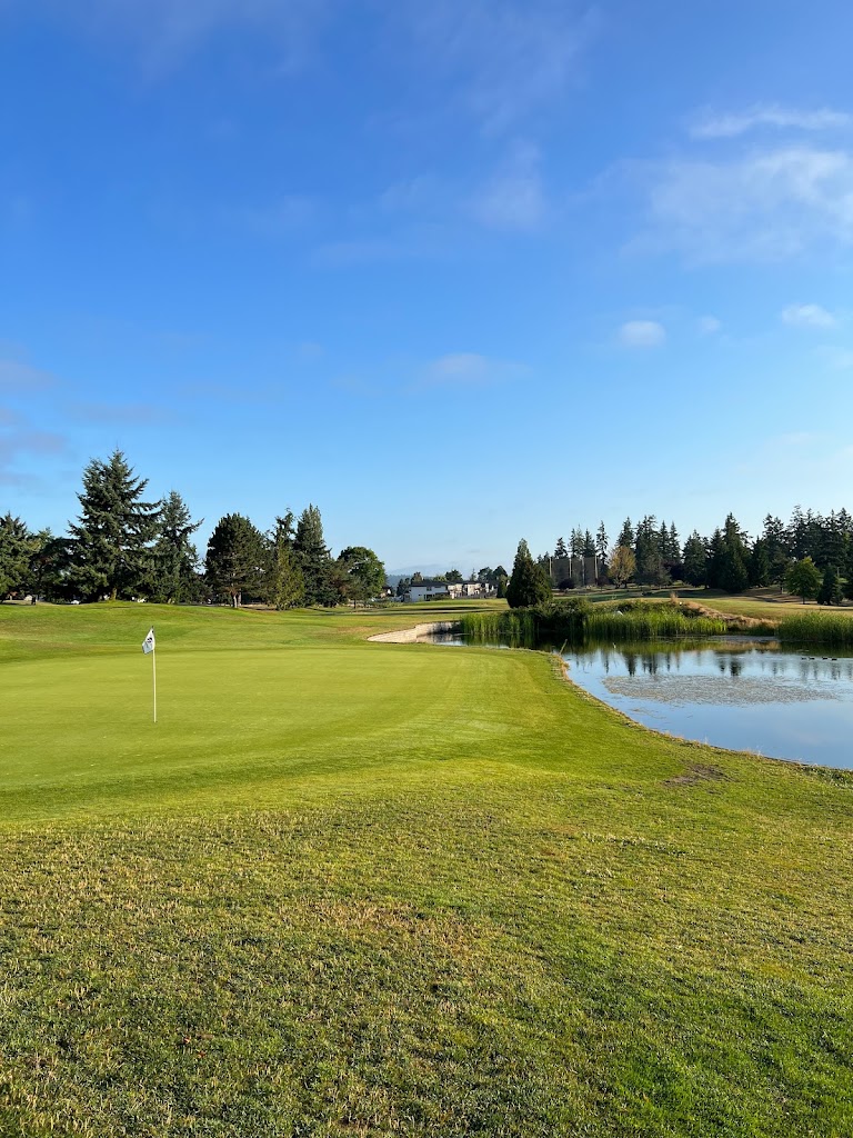 Panoramic view of a lush green golf course at Legion Memorial Golf Course. Smooth