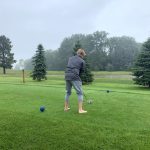 green grass with the flag in the hole.