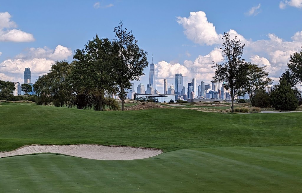 Panoramic view of a lush green golf course at Liberty National Golf Club. Smooth
