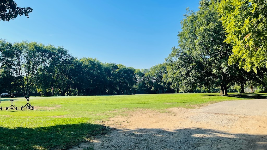Panoramic view of a lush green golf course at Lightning Bug Golf Course. Smooth