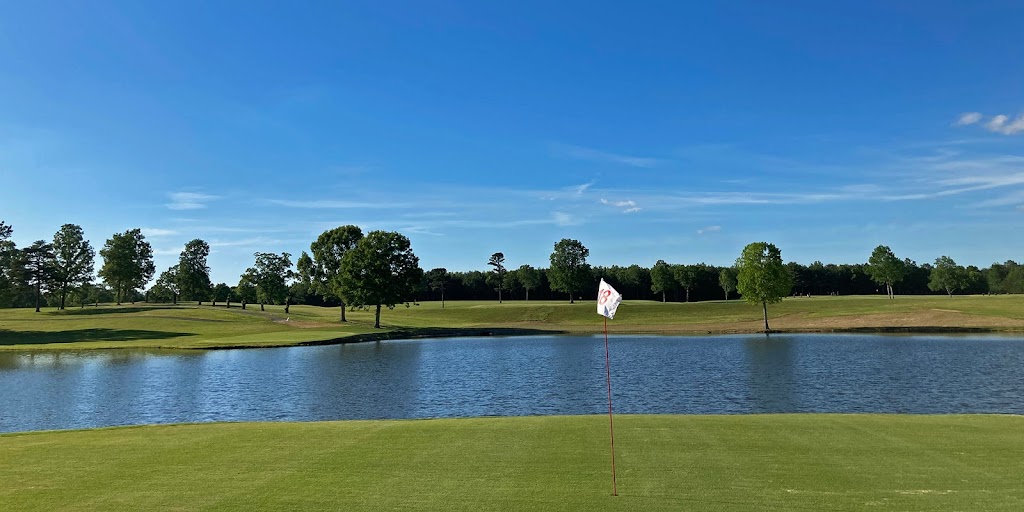 Panoramic view of a lush green golf course at Lil Mole Run Golf Course. Smooth