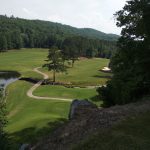 green grass with the flag in the hole.