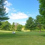 Panoramic view of a lush green golf course at Lincoln Homestead State Park - Golf Course. Smooth