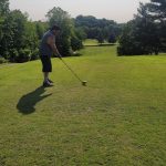 green grass with the flag in the hole.
