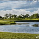 Panoramic view of a lush green golf course at Links At Carillon Golf Course. Smooth
