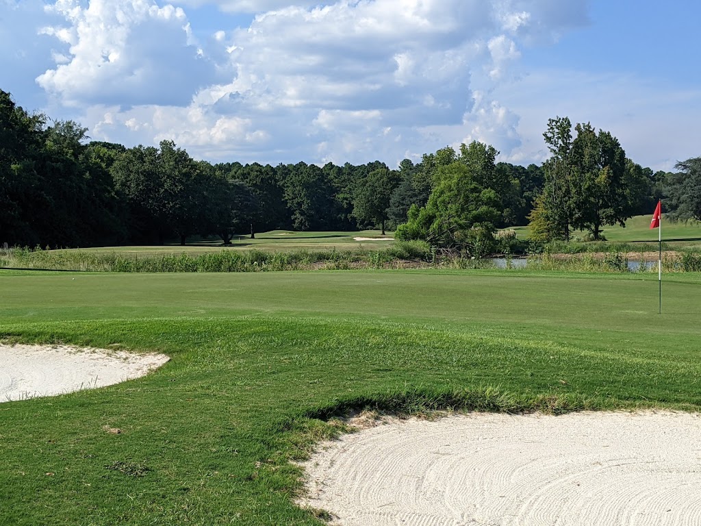 Panoramic view of a lush green golf course at Links At Redstone. Smooth