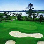 green grass with the flag in the hole.