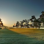 Panoramic view of a lush green golf course at Links At Stono Ferry. Smooth