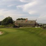 Panoramic view of a lush green golf course at Links at Outlook Golf Course. Smooth
