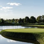 Panoramic view of a lush green golf course at Links at Perry Cabin. Smooth