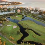 Panoramic view of a lush green golf course at Links on Longboat. Smooth