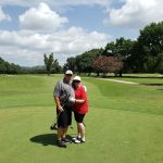green grass with the flag in the hole.