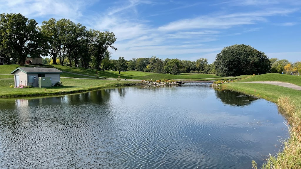 Panoramic view of a lush green golf course at Little Crow Golf Resort. Smooth