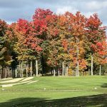 Panoramic view of a lush green golf course at Little Mountain Country Club. Smooth