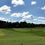 green grass with the flag in the hole.