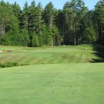 Panoramic view of a lush green golf course at Lochmere Country Club. Smooth