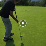 green grass with the flag in the hole.