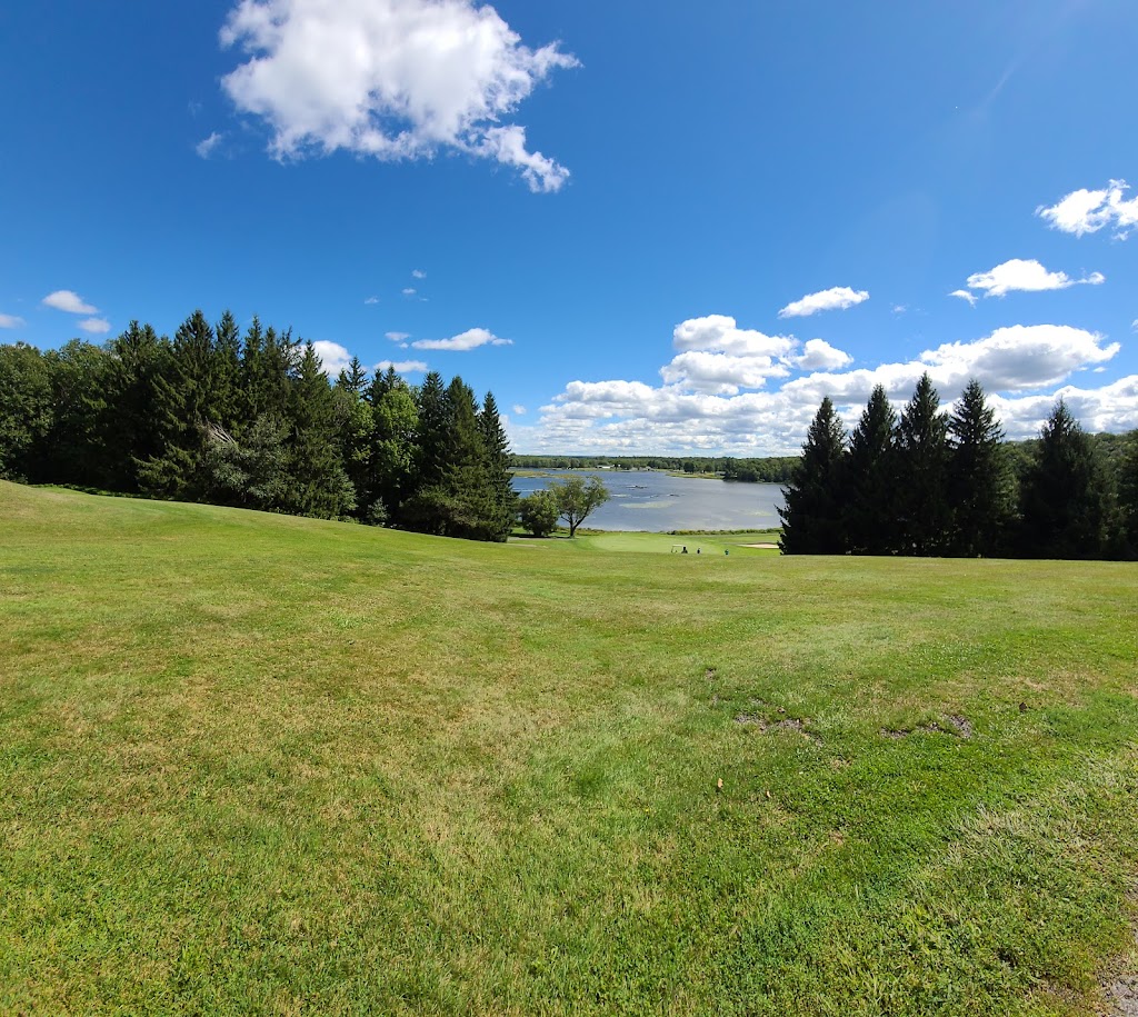 Panoramic view of a lush green golf course at Lochmor Golf Course. Smooth