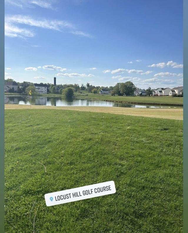 Panoramic view of a lush green golf course at Locust Hill Golf Course