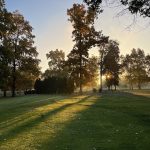 Panoramic view of a lush green golf course at Locust Hills Golf Club. Smooth