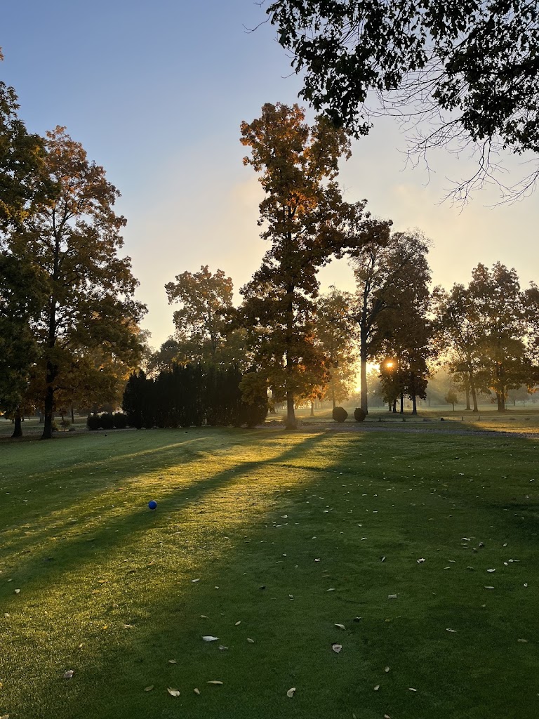Panoramic view of a lush green golf course at Locust Hills Golf Club. Smooth
