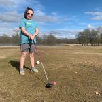 green grass with the flag in the hole.