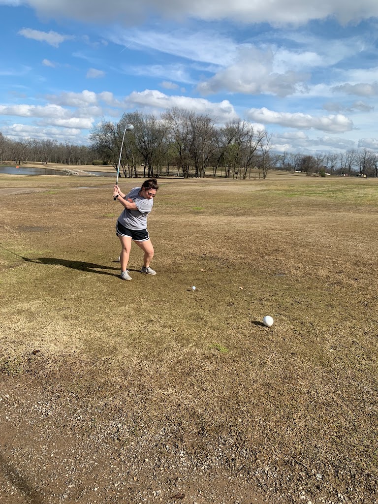 Panoramic view of a lush green golf course at Lone Pine Golf Course. Smooth