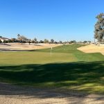 green grass with the flag in the hole.