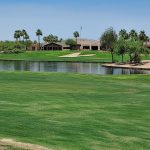 Panoramic view of a lush green golf course at Lone Tree Golf Club. Smooth