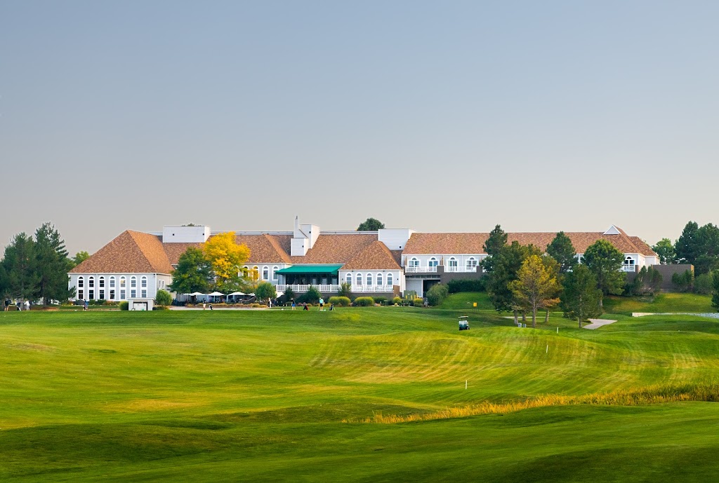 Panoramic view of a lush green golf course at Lone Tree Golf Club & Hotel. Smooth