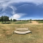 Panoramic view of a lush green golf course at Long Prairie Country Club. Smooth