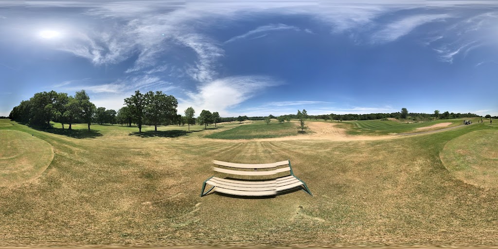 Panoramic view of a lush green golf course at Long Prairie Country Club. Smooth