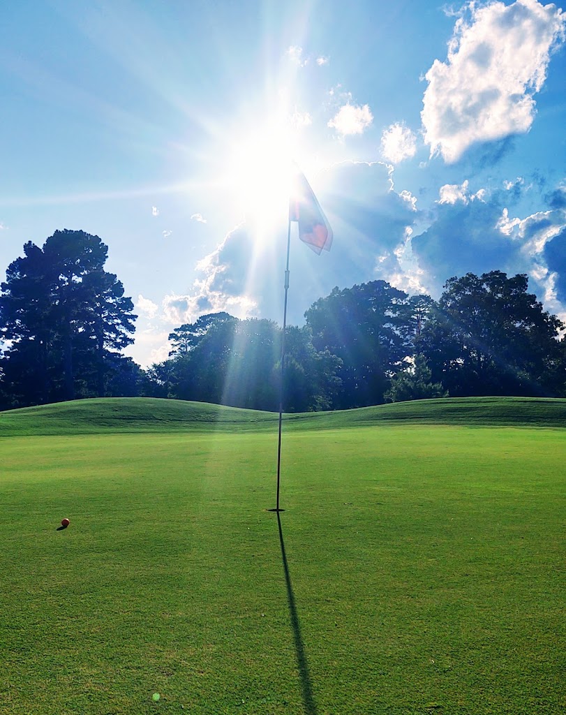 Panoramic view of a lush green golf course at Longhills Golf Course. Smooth